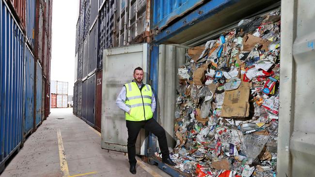 Tasman Logistics chief executive with a shipping container full of SKM recycling. Picture: Aaron Francis/The Australian