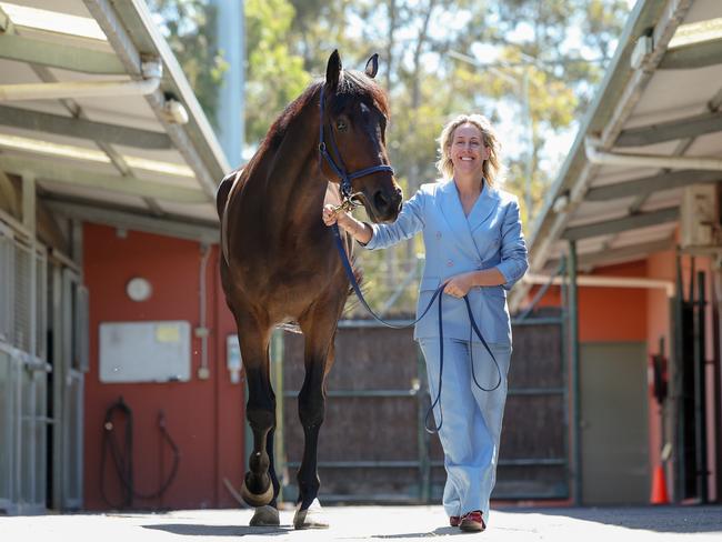 Kylie Rogers gets up close and personal with one of the stars of the show at the Flemington stables. Picture: Jason Edwards