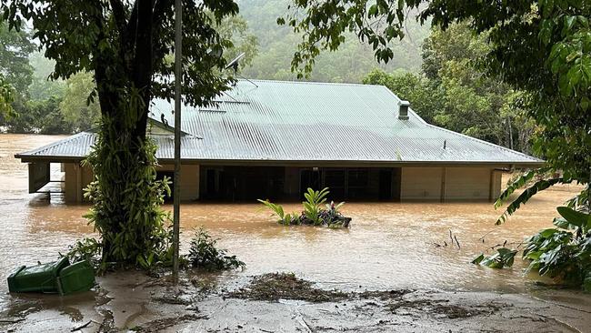 A house is submerged by floodwaters in Wujal Wujal during the record flood last wet season.