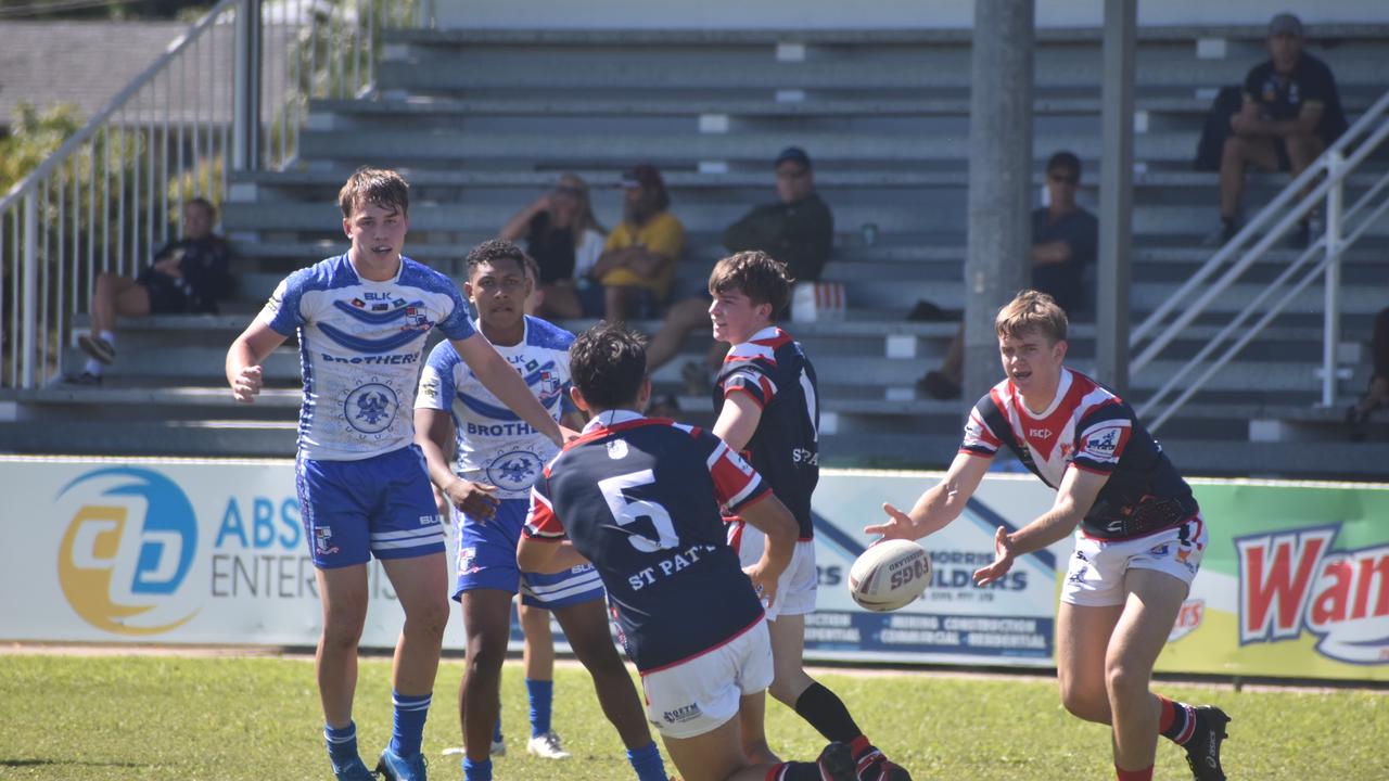 Cody Nielsen passes the ball to Bevan Rickard for St Patrick's College against Ignatius Park in the Aaron Payne Cup, July 20 2021. Picture: Matthew Forrest