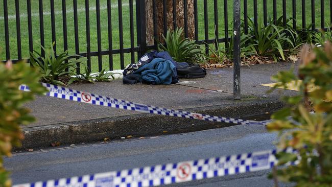 Pictured are items of clothing on the footpath possibly linked to a suspected stabbing on the grounds of Sydney University at Camperdown. Picture: Richard Dobson