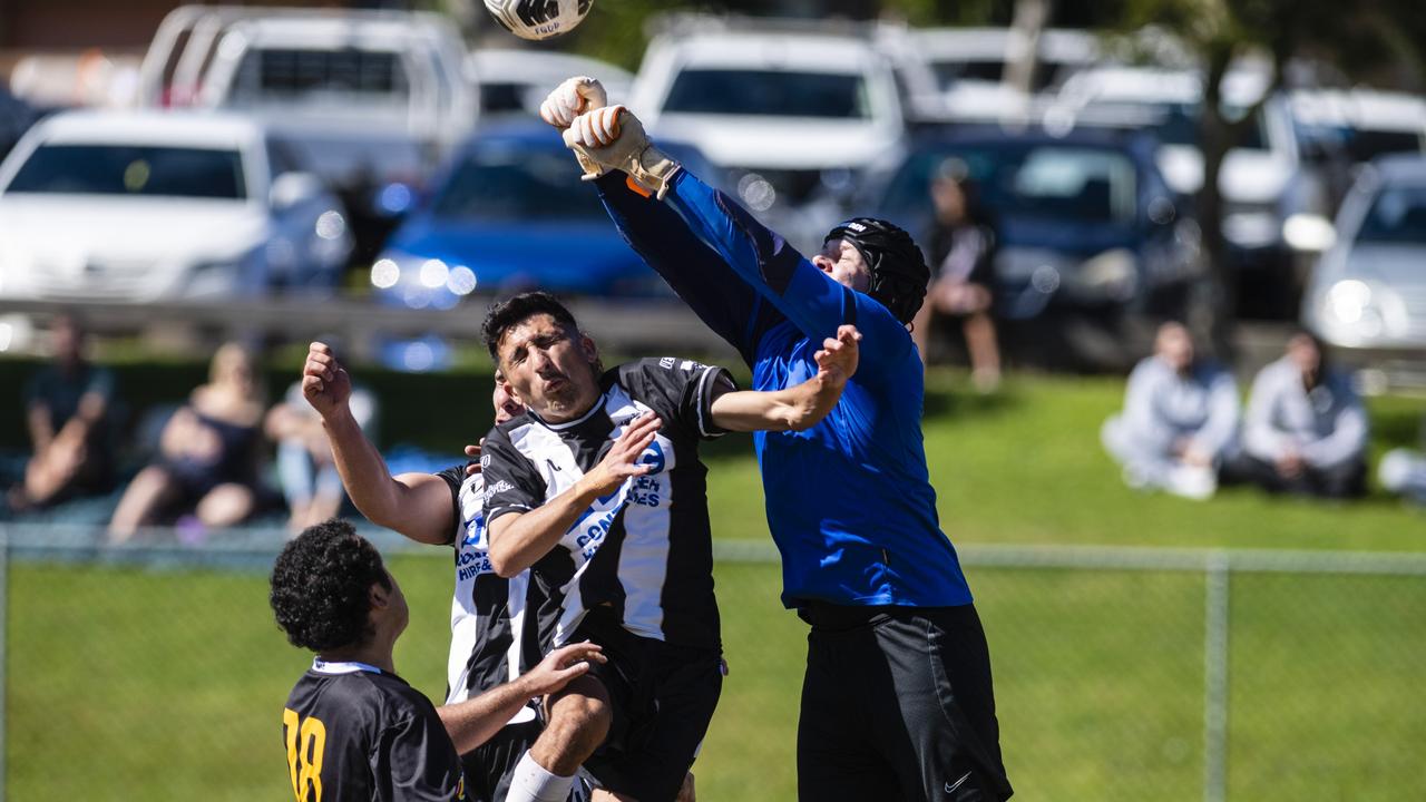 Amar Jurullah (centre) of Willowburn and West Wanderers keeper Zachary Vellacott in U23 men FQ Darling Downs Presidents Cup football at West Wanderers, Sunday, July 24, 2022. Picture: Kevin Farmer