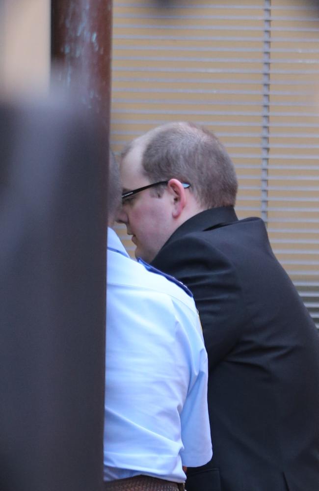 Derek Barrett is led into the Supreme Court for a sentencing hearing. Picture: John Grainger