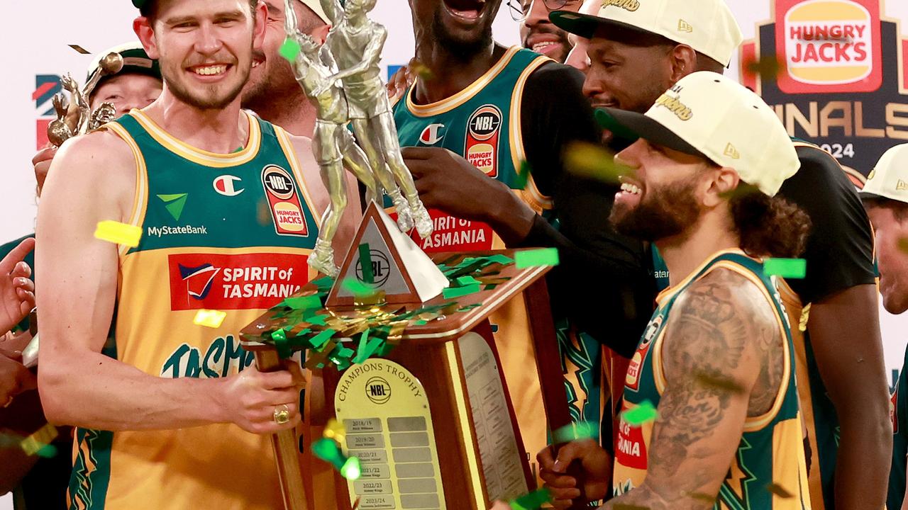 MELBOURNE, AUSTRALIA - MARCH 31: Clint Steindl (c) of the JackJumpers, Majok Deng of the JackJumpers, Milton Doyle of the JackJumpers and Jordon Crawford of the JackJumpers celebrate with the trophy after winning game five of the NBL Championship Grand Final Series between Melbourne United and Tasmania JackJumpers at John Cain Arena, on March 31, 2024, in Melbourne, Australia. (Photo by Kelly Defina/Getty Images) *** BESTPIX ***