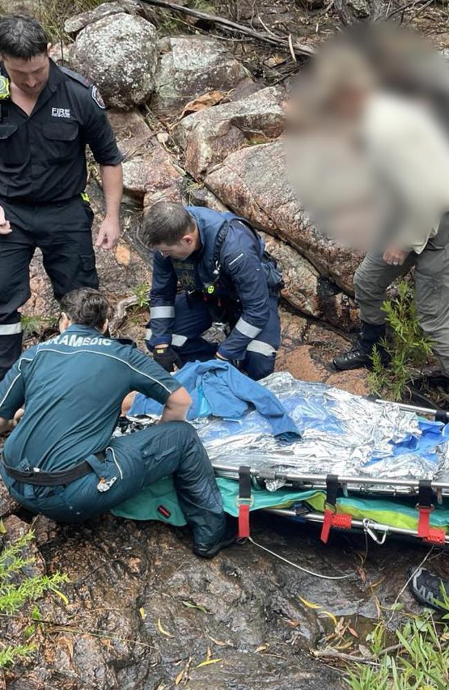 A LifeFlight rescue crewman and QAS flight paramedic were winched to a woman injured while hiking Mount Walsh, before she was airlifted to Bundaberg Hospital with serious knee injuries.