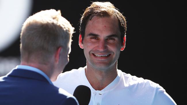 Roger Federer in his post-match interview with Jim Courier. (Photo by Mark Kolbe/Getty Images)