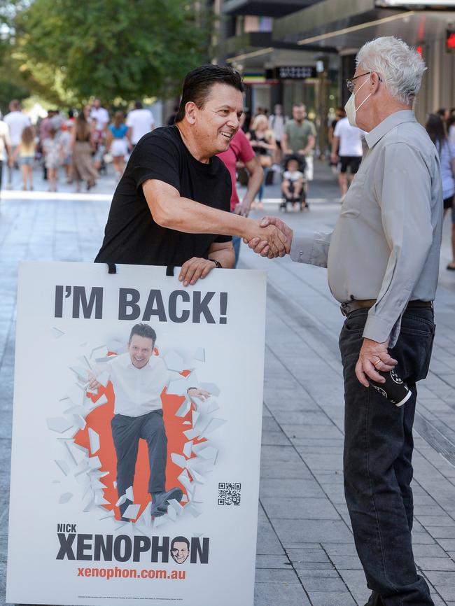 Nick Xenophon hands out election pamphlets in Rundle Mall to drum up support for his latest federal Senate bid. Picture: Brenton Edwards