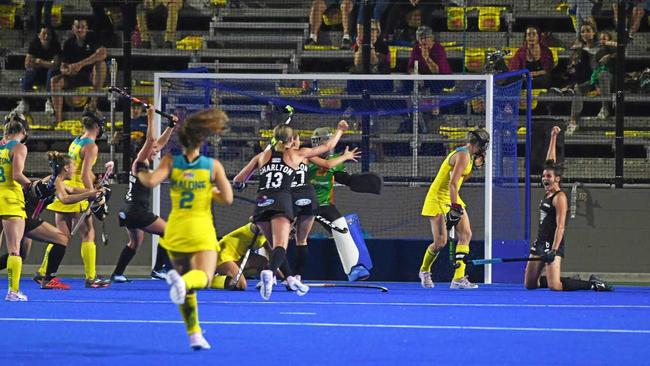 YOU BEAUTY! New Zealand celebrate after scoring one of three goals in their win over Australia in the opening Test on Thursday. Picture: Allan Reinikka ROK050919ahockey2