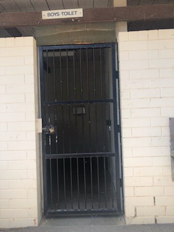 Parents of students at Modbury High School say outside toilet doors have been locked to ensure students use internal toilets with removed doors. Picture: Supplied