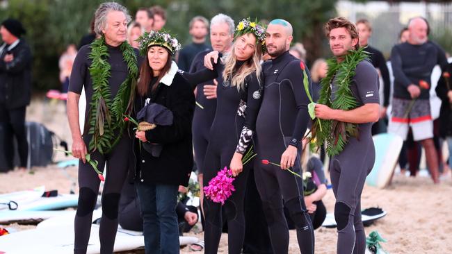 TRAGEDY: Alex Pullin's partner Ellidy Vlug is supported by family and friends in memory of Alex 'Chumpy' Pullin at a memorial in the days after his tragic death. Photo: Chris Hyde