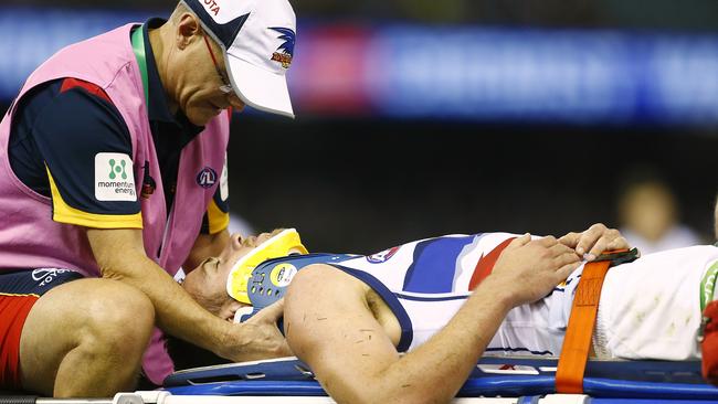 Brodie Smith being taken off the ground after being knocked out in Round 2, 2015. Picture: Wayne Ludbey