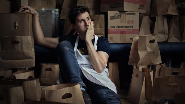 April 2020: Josh Niland, owner and head chef of Saint Peter in Paddington surrounded by the detritus of his quick pivot to takeaway meals. Picture: Rob Palmer/Canon Professional