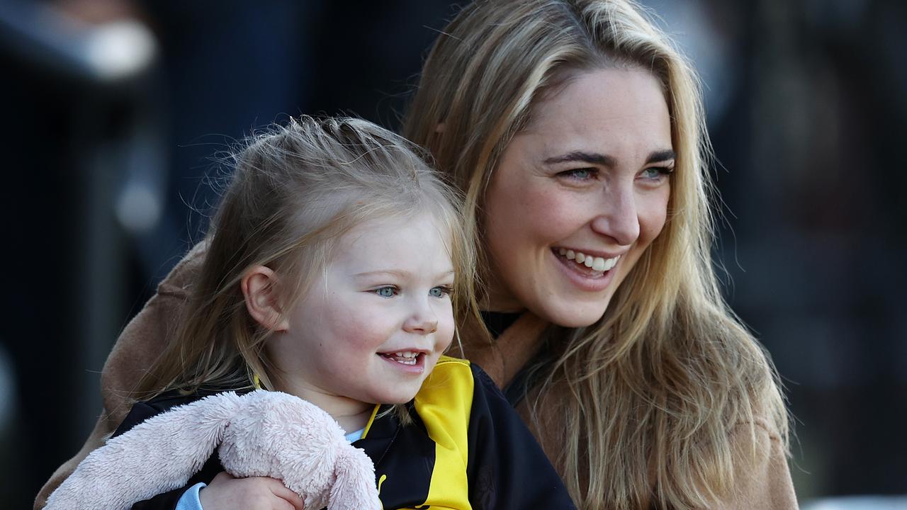 Carly Riewoldt and daughter Poppy watch husband and dad Jack Riewoldt train at Punt Rd before his 300th game in July 2021. Picture: Michael Klein