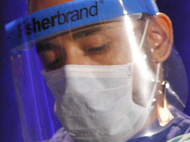 LOS ANGELES, CA - NOVEMBER 7: Registered nurse, Peter Sidhu, demonstrates how to put on and take off personal protective equipment, or PPE, during an Ebola safety presentation by the U.S. Centers for Disease Control and Prevention on November 7, 2014 in Los Angeles, California. The presentation is part of a statewide Ebola safety educational session demonstrating safety protocols for the first time. David McNew/Getty Images/AFP == FOR NEWSPAPERS, INTERNET, TELCOS & TELEVISION USE ONLY ==