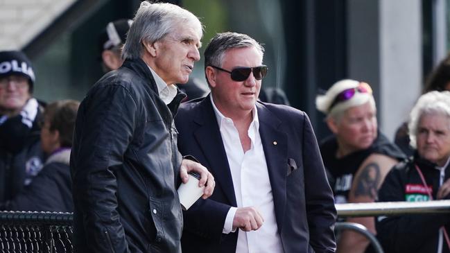 Collingwood champion Peter McKenna (left) talks with Eddie McGuire during a Magpies training session.