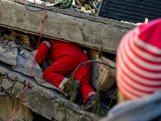 Rescuers carry out search operations among the rubble of collapsed buildings in Adiyaman, Turkey. Picture: AFP