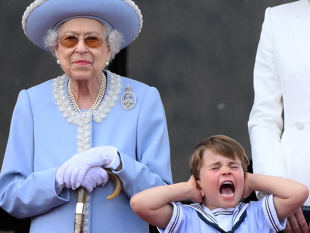 One is not amused. Prince Louis makes his thoughts about the RAF flyover known as the Queen looks on. Picture: AFP