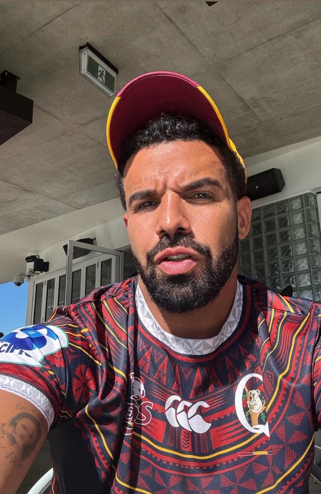 Rapper Drake picture wearing a Queensland Reds jumper and a Broncos hat while in Queensland. Rapper Drake has cancelled the remainder of his Australia and New Zealand tour Picture Instagram