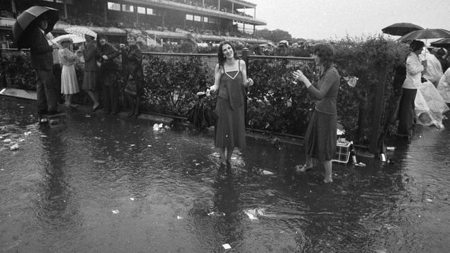 Punters celebrate despite the weather in 1976.