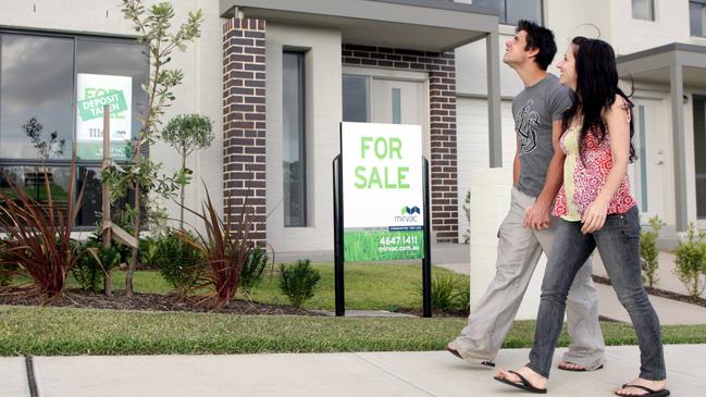 First home buyers Graham Burden and Emma Chenery looking at homes for sale near where they have bought a block of land at Spring Farm in Camden, southwest of Sydney.