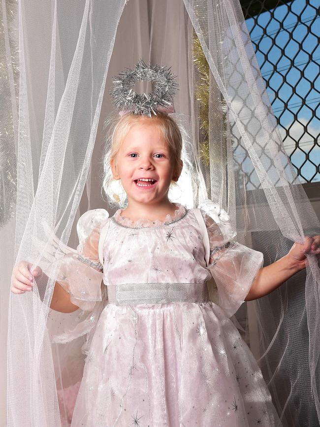 Lucy Flowers, 4, at Geckos Family Centre on Lavarack Barracks celebrating Christmas. Picture: Shae Beplate.