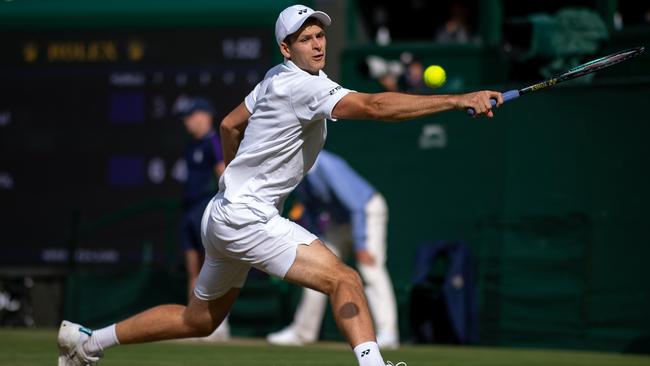 Hubert Hurkacz of Poland plays a backhand during his men's Singles Quarter Final match against Roger Federer.