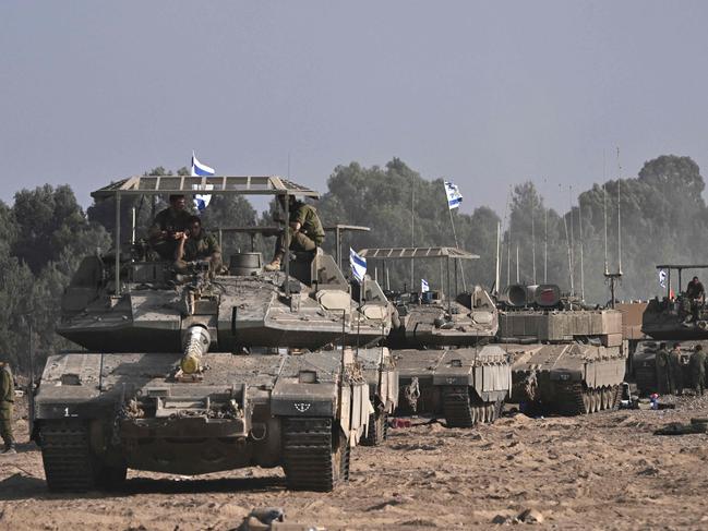 Israeli military armoured vehicles deploy along Israel's border with Gaza. Picture: AFP