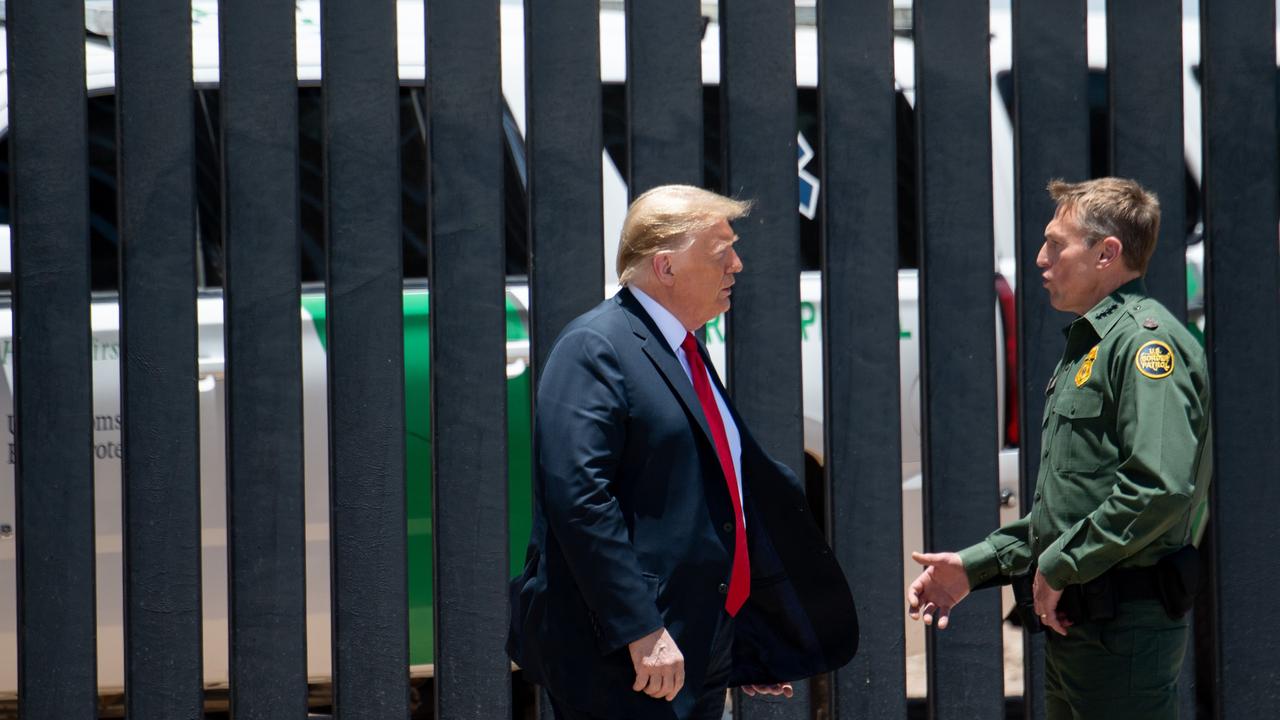 Mr Trump speaking with US Border Patrol Chief Rodney Scott. Picture: Saul Loeb/AFP