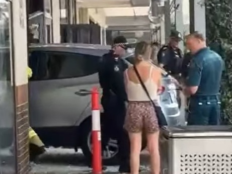 Paramedics and police on scene after a car smashed into Noodle Box in Pacific Pines. Photo: Facebook/Koby Drain