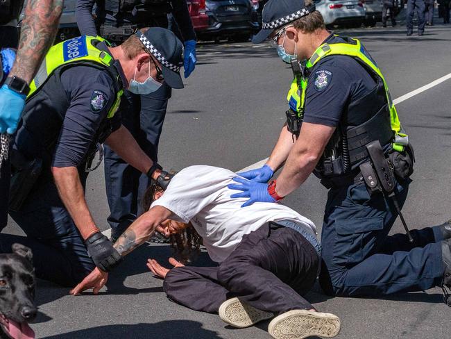 MELBOURNE, AUSTRALIA - NewsWire Photos - OCTOBER 02, 2021: Police seen taking down a protestor at an anti vax, anti lockdown protest in Melbourne. Picture: NCA NewsWire/Sarah Matray