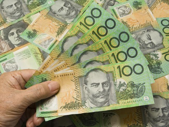 A Hand fanning out 500 Australian dollars. Australian money cash generic