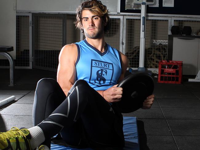 Sturt footballer, Brodie Grundy, working out in the Double Blues gym in November ahead of the 2012 AFL Draft. Picture: FILE