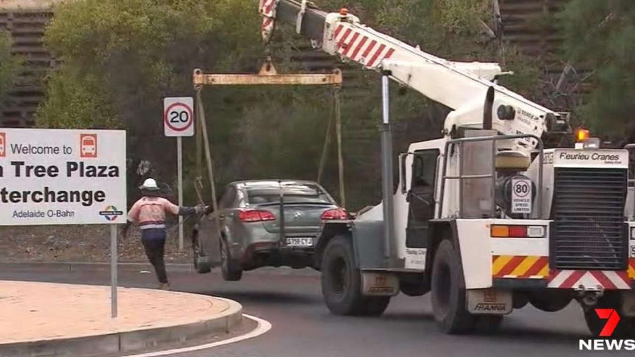 A car is towed from the O'Bahn after driving onto it on Wednesday morning. Picture: 7NEWS