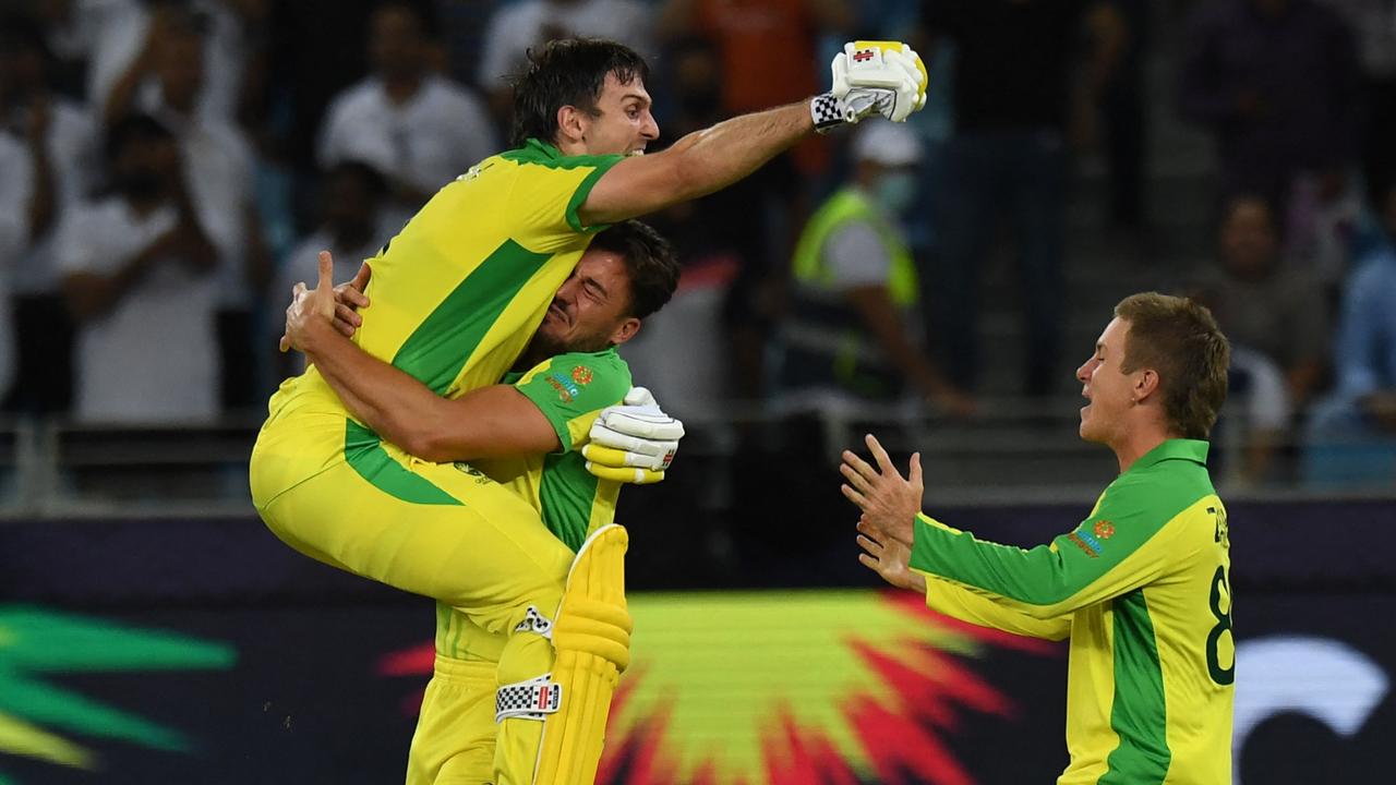 Mitchell Marsh celebrates the World Cup win with teammates. Picture: Indranil Mukherjee / AFP