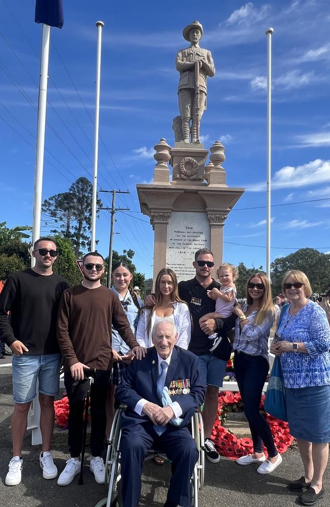 World War II veteran Keith Arneman with family members Cody, Nicholas, Jasmine, Sapphire, Jesse, Sasika (1), Rebecca and Karen at the 2024 Anzac Day service at the Upper Coomera cenotaph. Picture: Keith Woods.