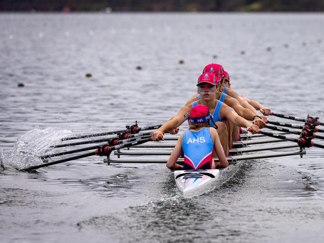 The All Hallows First VIII hard at rowing.