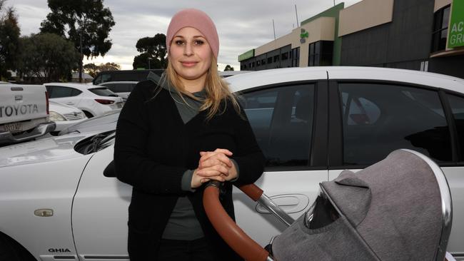 Anna Farkas waits for her child during afternoon pick-up at Glenelg Primary School. Picture: Emma Brasier