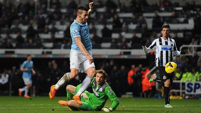 Tim Krul watches on as the ball slips past.