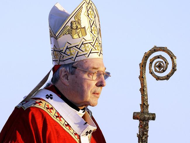 Cardinal George Pell walks onto the stage for the opening mass for World Youth Day in Sydney. Picture: AP Photo/Rick Rycroft