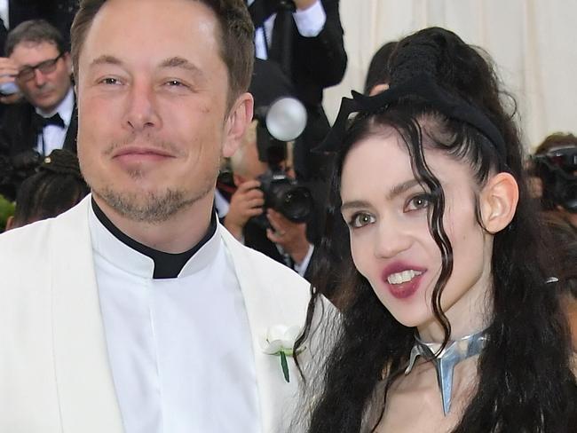 NEW YORK, NY - MAY 07:  Elon Musk and Grimes attend the Heavenly Bodies: Fashion & The Catholic Imagination Costume Institute Gala at The Metropolitan Museum of Art on May 7, 2018 in New York City.  (Photo by Neilson Barnard/Getty Images)