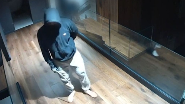 A masked, barefoot intruder creeping through an Epping home during a break-in has been caught on video in terrifying CCTV footage.