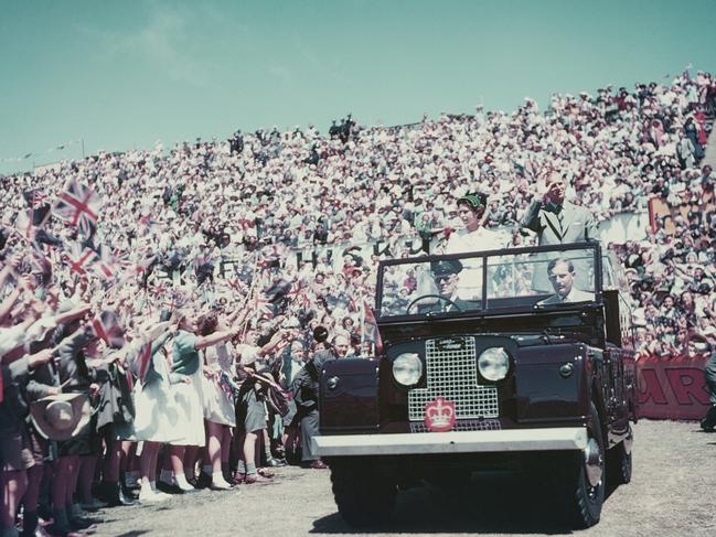 Queen Elizabeth II and Prince Philip wave to the crowd whilst on their Commonwealth visit to Australia in 1954. Picture: Fox Photos/Hulton Archive/Getty Images