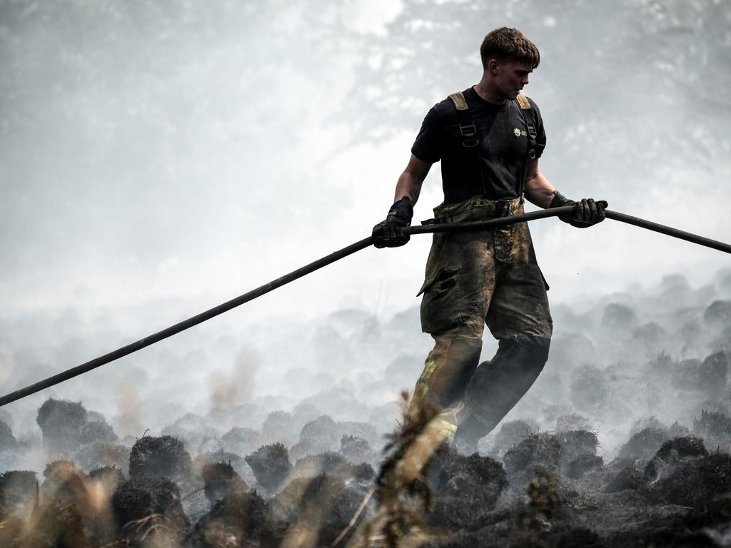 Firefighters battle a blaze that encroached on nearby homes in Sheffield, England, July 2022. Famous for its usually cool weather, the UK sweltered through record-breaking heat this year, raising concern about just how bad the climate crisis is getting. Picture: Christopher Furlong/Getty Images