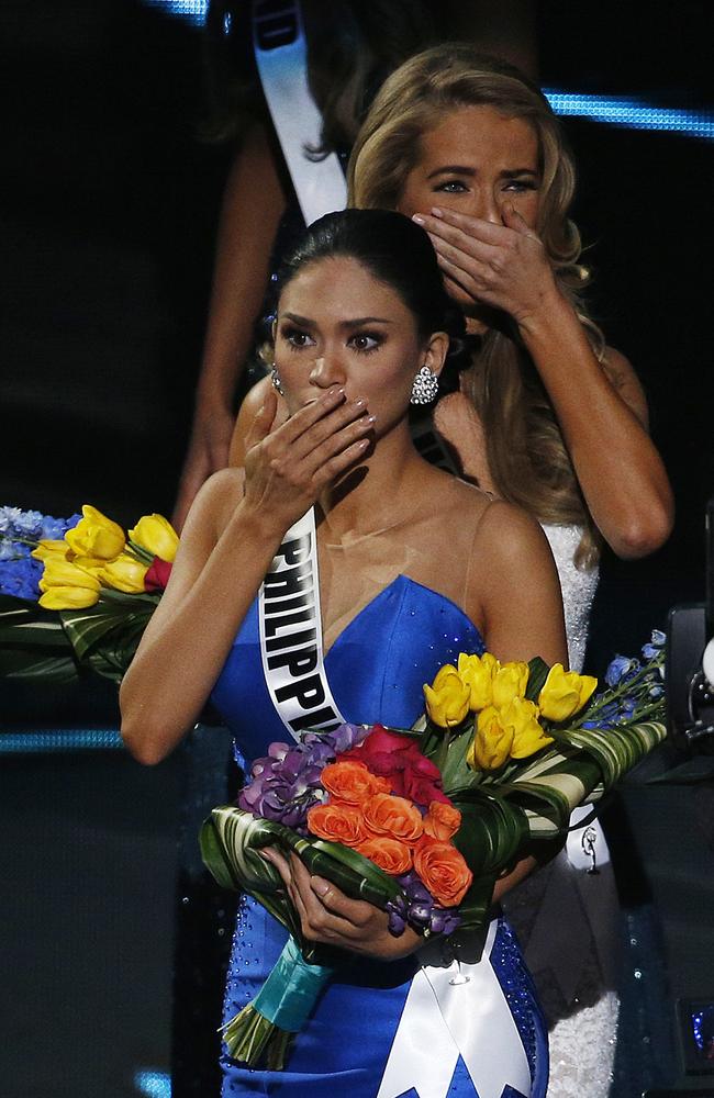 Miss Philippines Pia Alonzo Wurtzbach, front, reacts after she was announced as the new Miss Universe at the Miss Universe pageant. Picture: John Locher/AP Photo.