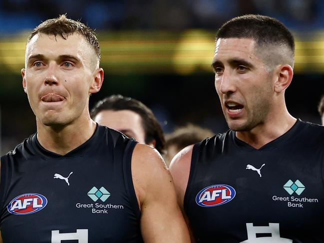 MELBOURNE, AUSTRALIA - MARCH 13: Patrick Cripps (left) and Jacob Weitering of the Blues look dejected after a loss during the 2025 AFL Round 01 match between the Richmond Tigers and the Carlton Blues at the Melbourne Cricket Ground on March 13, 2025 in Melbourne, Australia. (Photo by Michael Willson/AFL Photos via Getty Images)