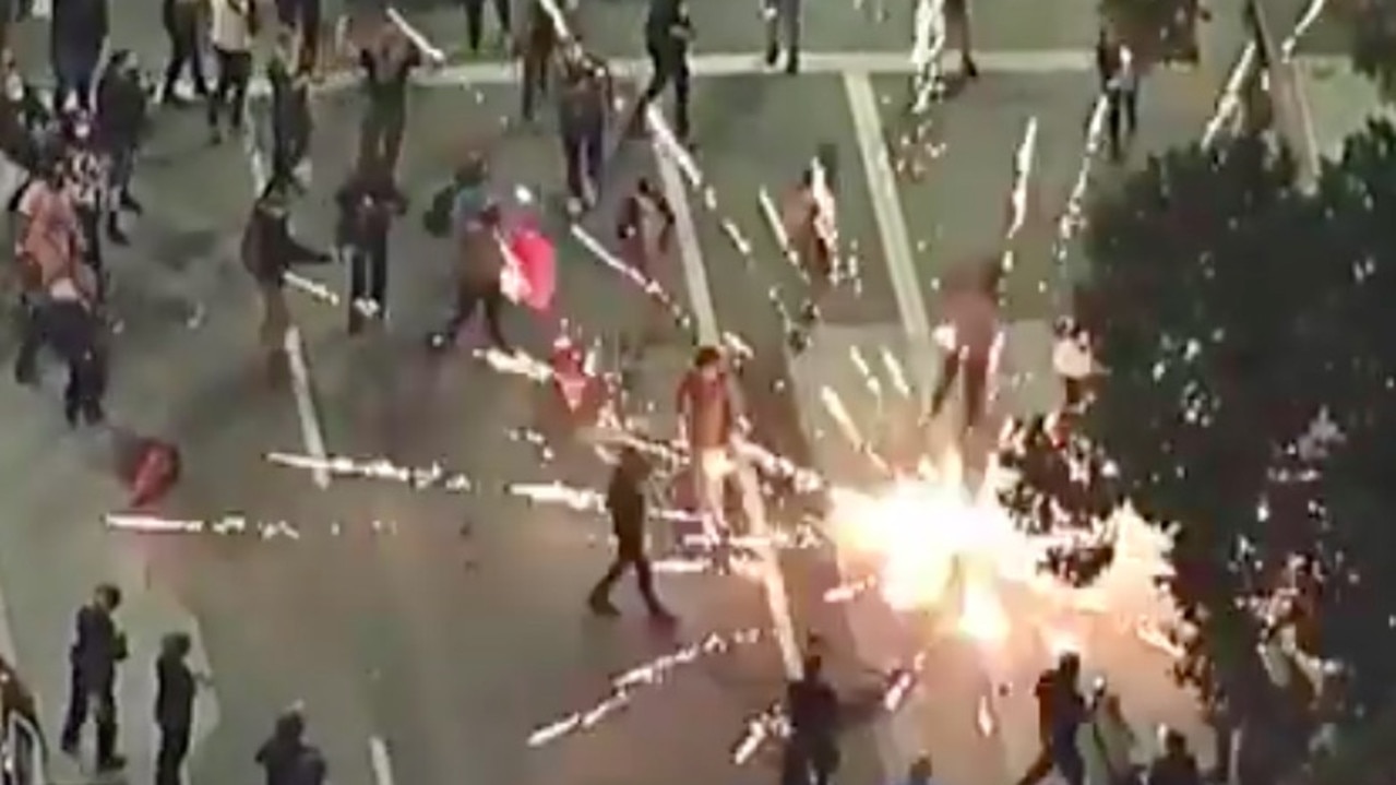 Fireworks explode in the middle of protesters in downtown Los Angeles. Picture: ABC7