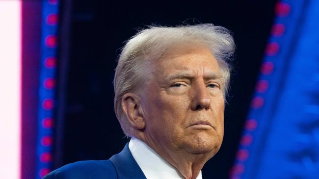 PHOENIX, ARIZONA - DECEMBER 22: U.S. President-elect Donald Trump looks on during Turning Point USA's AmericaFest at the Phoenix Convention Center on December 22, 2024 in Phoenix, Arizona. The annual four day conference geared toward energizing and connecting conservative youth hosts some of the country's leading conservative politicians and activists.   Rebecca Noble/Getty Images/AFP (Photo by Rebecca Noble / GETTY IMAGES NORTH AMERICA / Getty Images via AFP)