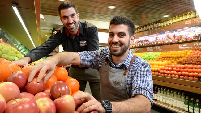 Putting customers first: Brothers Paul and Michael Capobianco at work in one of their stores. Picture: Campbell Brodie