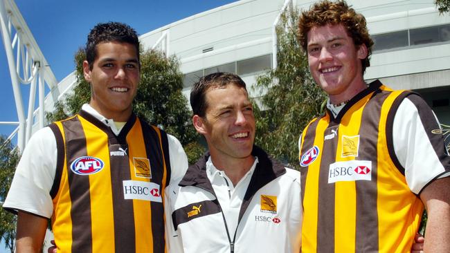 SPORT AFL DRAFT 2004. Hawthorn coach Alistair Clarkson with his first two draft picks, Jarryd Roughead and Lance Franklin.