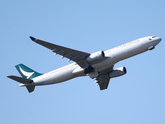 A Cathay Pacific jet aircraft departs Cairns Airport bound for Hong Kong, as seen from Stan Williams Park, Manunda. PICTURE: BRENDAN RADKE